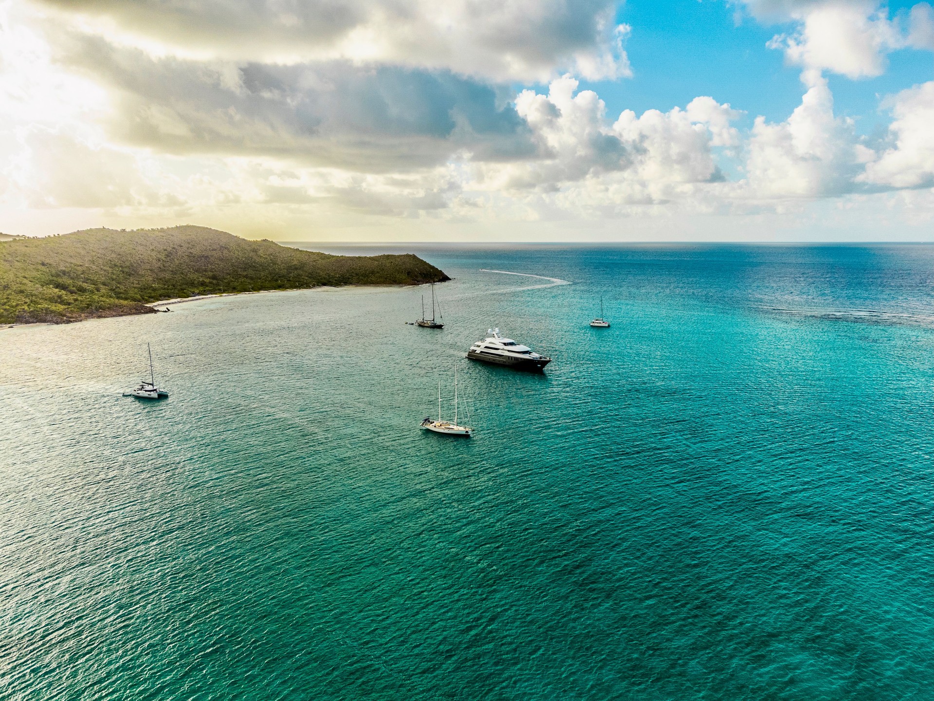 Beautiful BVI British Virgin Island Sailing destination. Aerial view of Catamaran in front of beach and famous sailing destination